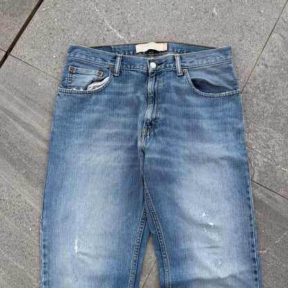 unreal fade. levi’s 557 relaxed bootcuts - 34x32”