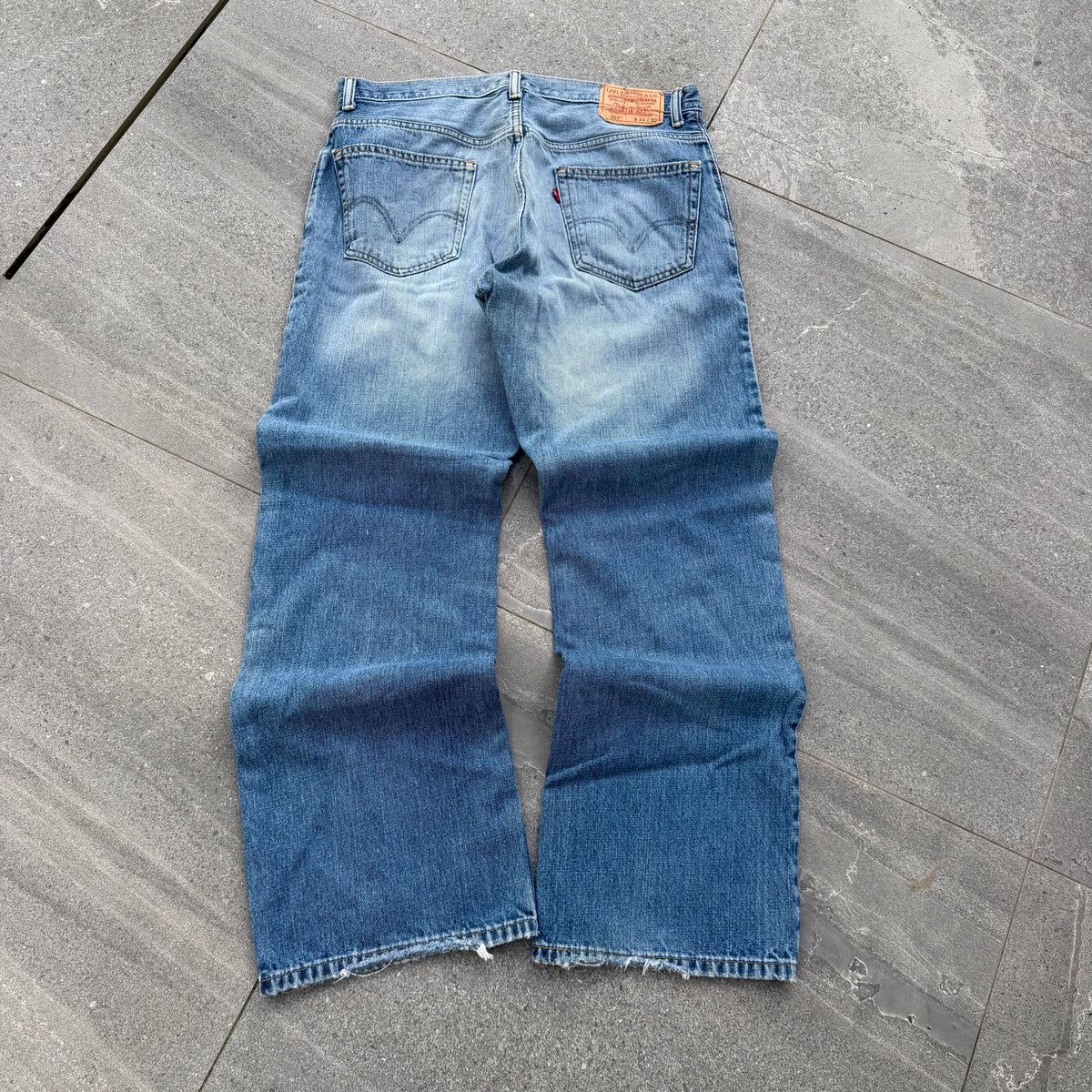 unreal fade. levi’s 557 relaxed bootcuts - 34x32”
