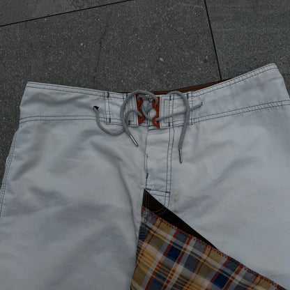 the grail pair of shane dorian billabong boardies. size 34”