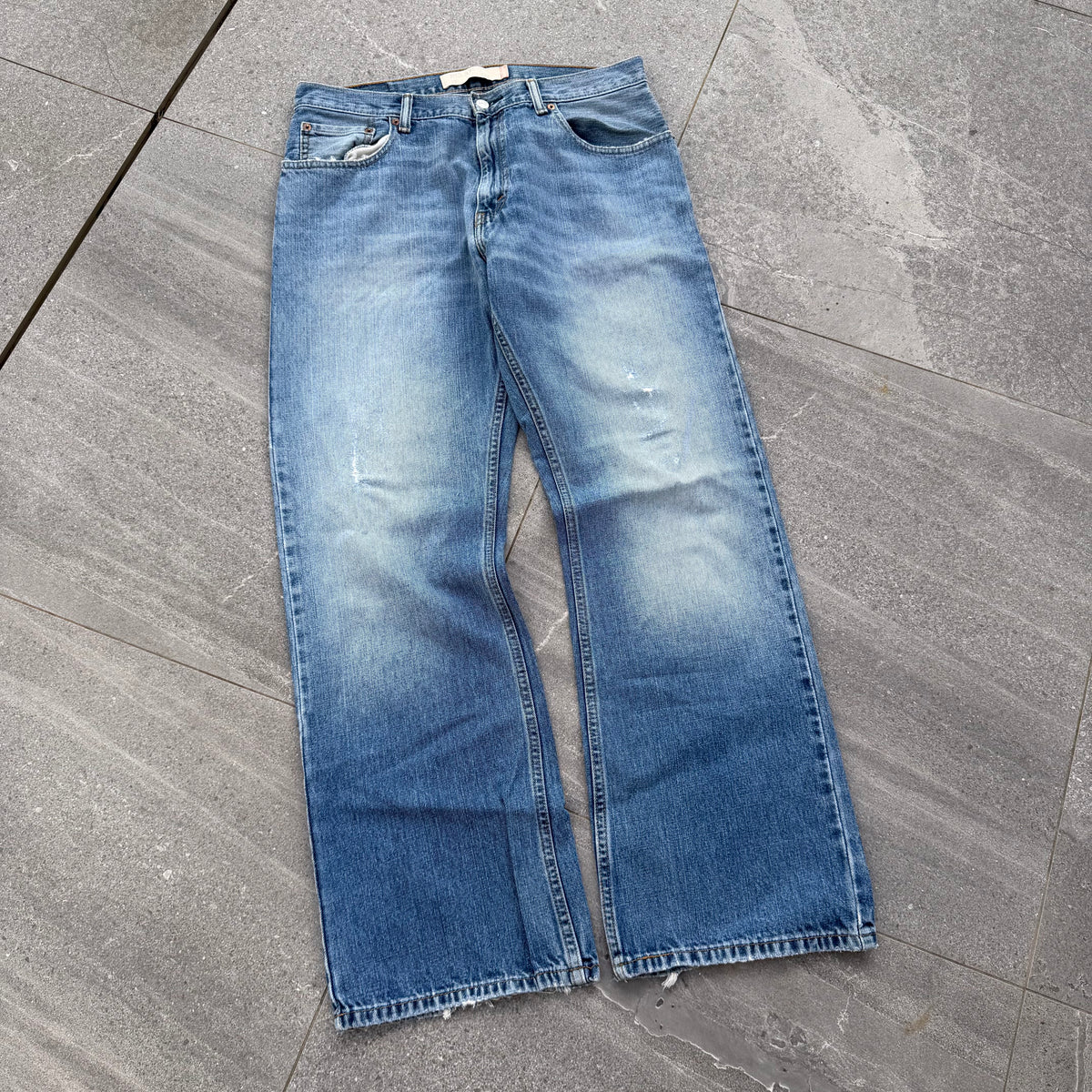 unreal fade. levi’s 557 relaxed bootcuts - 34x32”