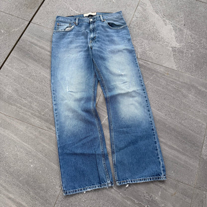 unreal fade. levi’s 557 relaxed bootcuts - 34x32”