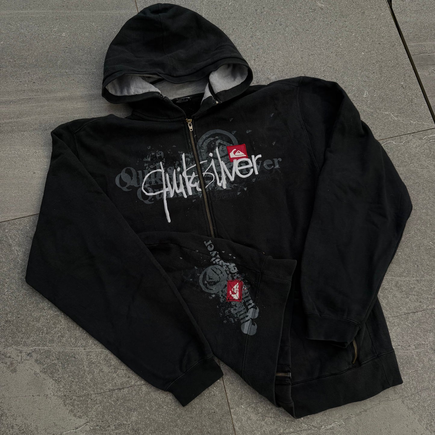 i have never seen this before. quiksilver hybrid zip - L