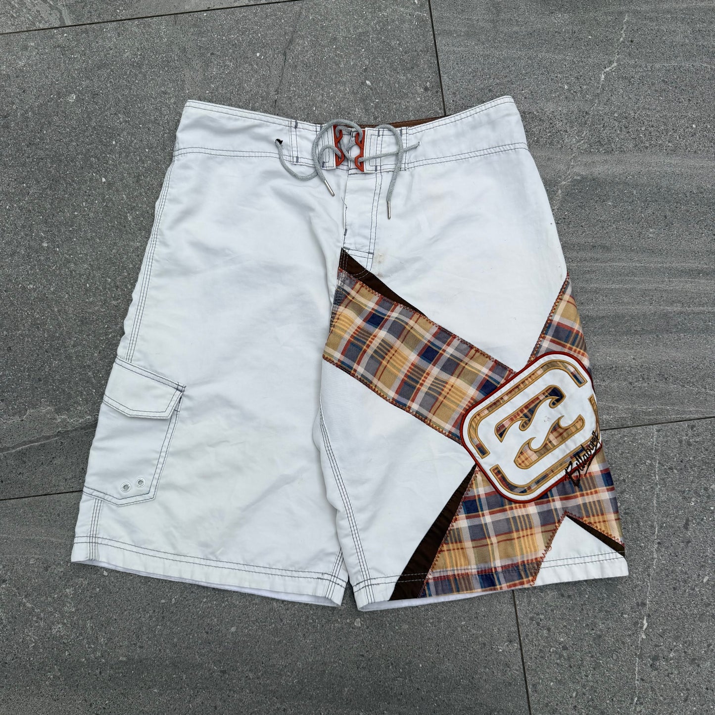 the grail pair of shane dorian billabong boardies. size 34”