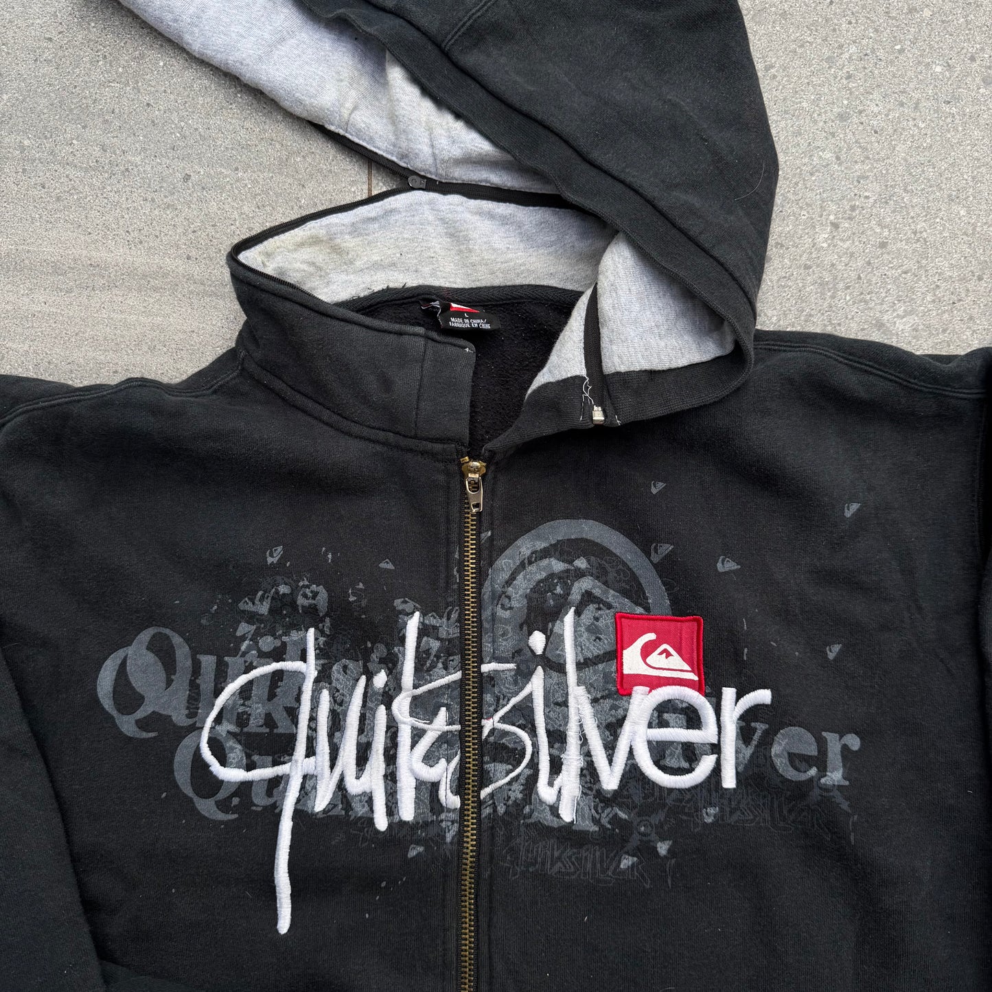 i have never seen this before. quiksilver hybrid zip - L