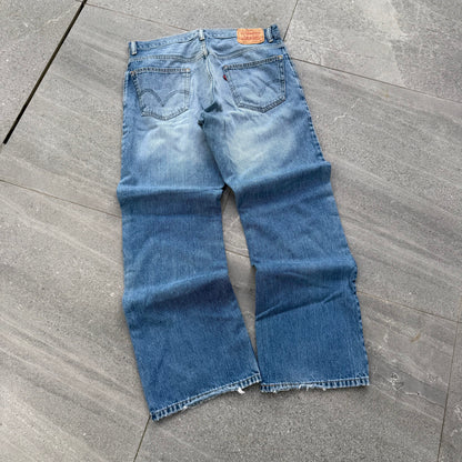 unreal fade. levi’s 557 relaxed bootcuts - 34x32”